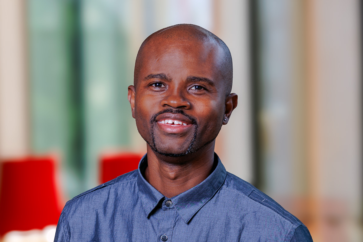 Professional headshot of Kobe photographed at the National Arts Centre in Ottawa