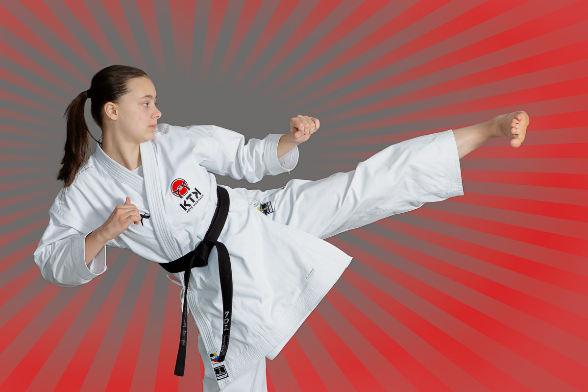 Martial arts instructor performing a side kick during a sports photography session in Ottawa