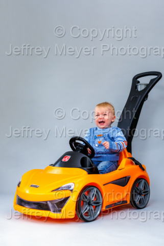 My baby boy behind his McLaren 570S  
