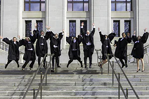 Law students celebrate on the steps of the Supreme Court after passing the bar.  Photo by Jeffrey Meyer